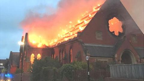 Fire ravaging the Trinity United Reform Church building in May 2017