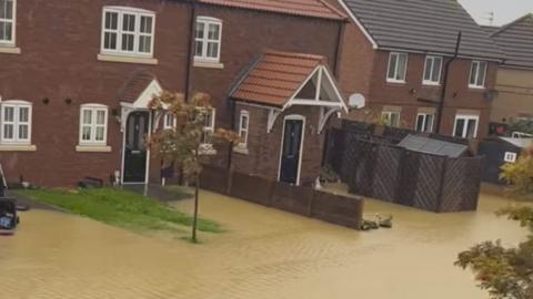 Flooding outside homes on Pitsford Close on 20 October