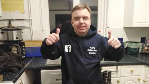 Cal in his Cal's Delivery Service hoody