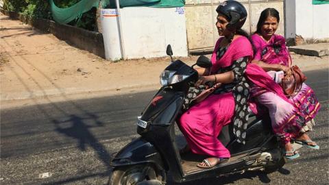 Women travel on a scooter in Thiruvananthapuram (Trivandrum), Kerala, India, on March 3, 2019.