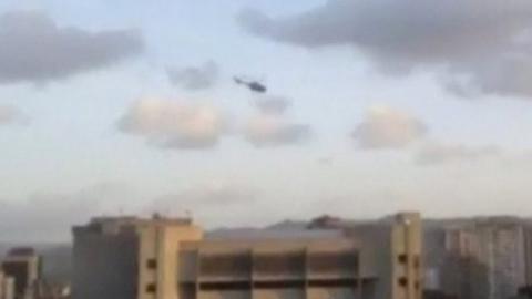 A police helicopter flies over Venezuela"s Supreme Court building in Caracas June
