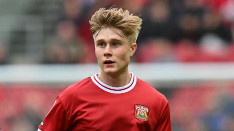 Sam Bell stands on the pitch during Bristol City's defeat by QPR