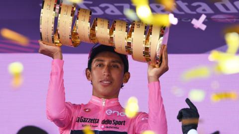 Egan Bernal holds up the trophy for winning the 2021 Giro d'Italia