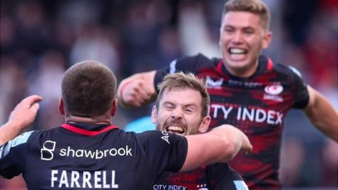 Saracens players celebrate victory over Gloucester