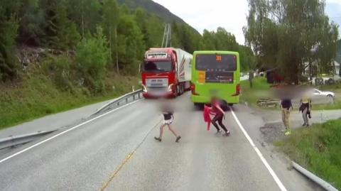 A child crossing a road.