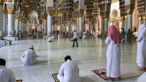 Worshippers pray in the Prophet's Mosque in Medina after it reopened for worshippers in late May