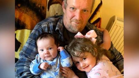 Garry Owen Roberts with his two grandchildren