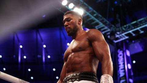 Anthony Joshua looks on after a loss