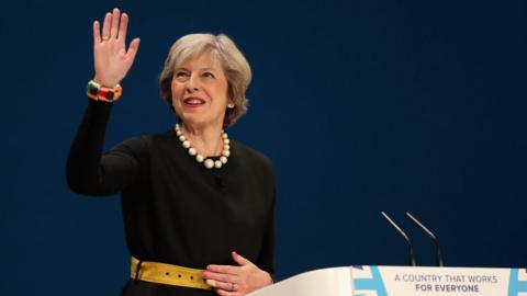 Theresa May takes to the stage to deliver a speech to about Brexit on the first day of the Conservative Party Conference 2016