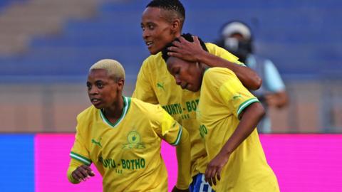 Lelona Daweti (left) and her Mamelodi Sundowns team-mates celebrate a goal against Bayelsa Queens