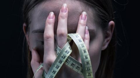 Woman tortured by tape measure