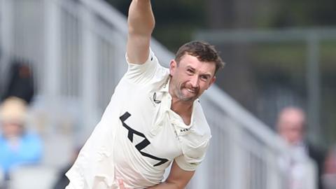Leg-spinner Cameron Steel bowling for Surrey