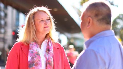 Independent candidate Kylea Tink is pictured talking to a voter