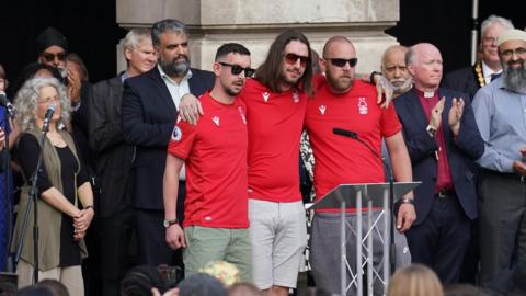 Ian Coates' sons wearing Nottingham Forest shirts at vigil