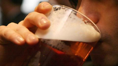 A man drinking beer