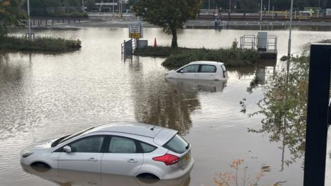 Cars in flooded car park