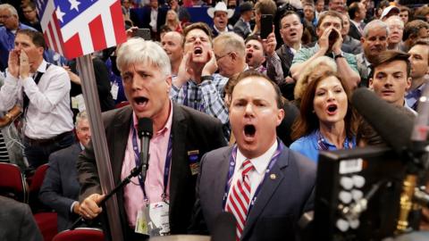 Sen. Mike Lee, (R-UT) and Phil Wright, Vice Chair of the Utah State Delegation (L) shout no to the adoption of rules withou a roll call vote on the first day of the Republican National Convention on July 18, 2016