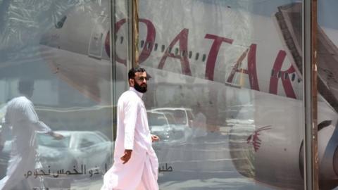A man walks past the Qatar Airways branch in the Saudi capital Riyadh. Photo: June 2016