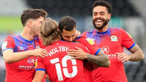 Blackburn Rovers players celebrate against Derby County