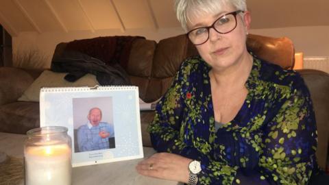 Jane Nicholls with a photo of late brother Paul Ridd