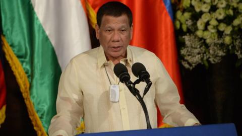 Filipino President Rodrigo Duterte speaking at a podium