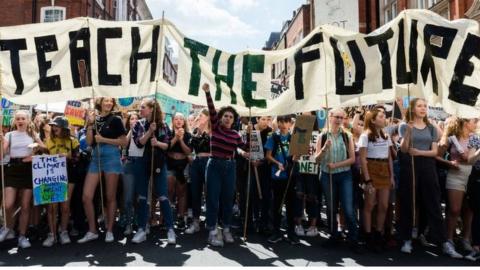 Teach the Future banner at climate demo