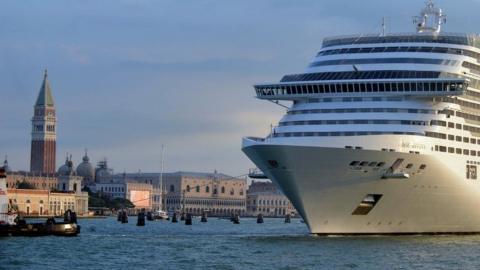 A giant cruise ship arrives in front of Saint-Mark's square in Venice on September 21, 2013