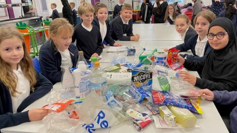 Primary school pupils sorting plastics