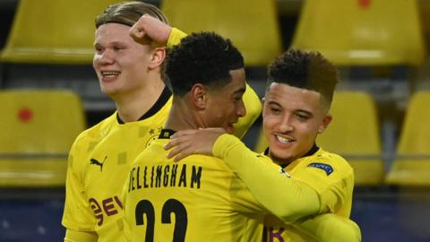 Jude Bellingham, Erling Braut Haaland and Jadon Sancho celebrate