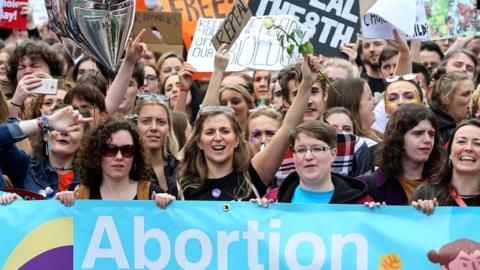 Protesters hold up placards as they take part in the March for Choice, calling for the legalising of abortion in Ireland after the referendum announcement in Dublin on 30 September 2017