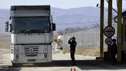 A officer of the Kosovo border police checks a lorry leaving Kosovo at a checkpoint to Serbia on February 19, 2008 in Merdar, Kosovo