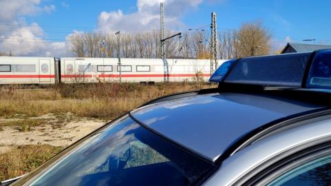 Train and police car