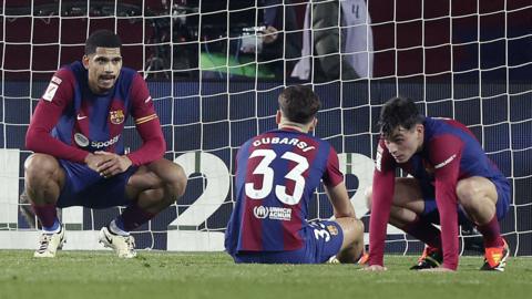 Barcelona players react during their defeat by Villarreal