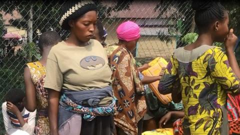 Residents of Goma in the Democratic Republic of Congo fetch water after a volcanic eruption cut supplies, 2 June 2021