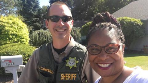 Janelle Bynum pictured with the police officer who responded to the call