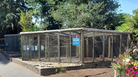 The aviaries next to a path