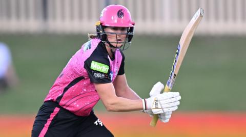 Ellyse Perry of Sydney Sixers plays a shot