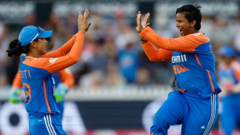 Deepti Sharma and Smriti Mandhana celebrate a wicket for India