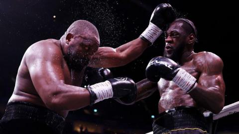 Derek Chisora's eyes roll back as he is punched by Deontay Wilder