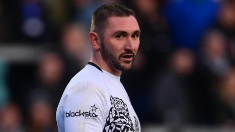 Rich Lane standing on the pitch during a Bristol match