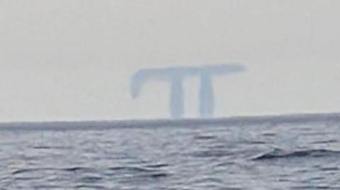 A Fata Morgana in the distance taken from a boat