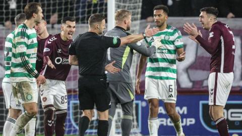 Referee Steven McLean initially showed Celtic's Auston Trusty a yellow card before VAR intervened