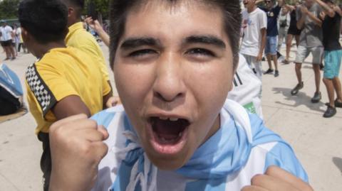 Fans celebrate after Argentina won the Qatar 2022 FIFA World Cup title, in Rosario, Argentina, 18 December 2022.