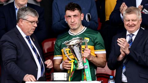 Paudie Clifford is handed the O'Connor Cup in Ennis