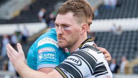 Scott Taylor embraces Sam Walters after Hull's defeat by Leeds