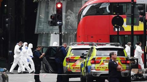 Police and forensics teams in the aftermath of the June 2017 London Bridge attacks