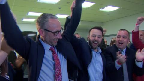 Colum Eastwood celebrating with a successful SDLP election candidate