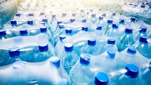 Bottled water in cellophane