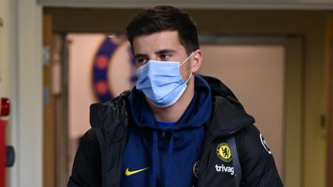 Chelsea midfielder Mason Mount wears a face mask as he walks in the tunnel before a Premier League match against Manchester United