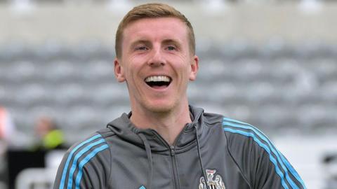Matt Targett, pictured smiling during pre-season for Newcastle